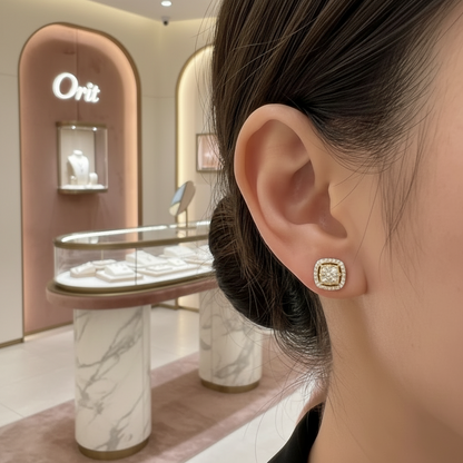 Close-up of a person wearing gold earrings in a jewelry store.